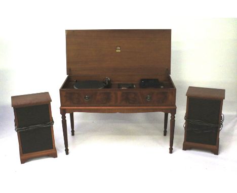 A vintage Dynatron Hi Fi stereo in a mahogany effect cabinet. With Garrard 35SB turntable, a tape deck and tuner, with a matc