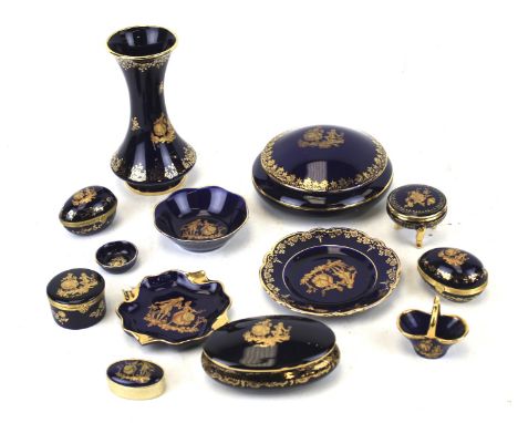 Fourteen 20th century Limoges porcelain ornaments. All featuring gilt details on a navy blue ground, including a trumpet vase