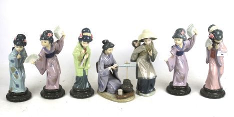 Lot 152 - Two Lladro figures, two Nao figures and a