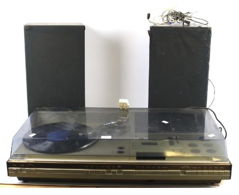 A 1970s HMV Dolby Hi Fi stereo unit MCH 12. With record deck, tape recorder, tuner, headphone jack and a pair of speakers, L8