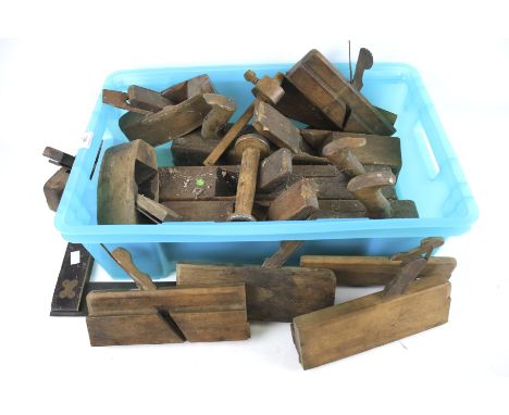 An assortment of woodwork tools. Including a set square, wood planes, etc.