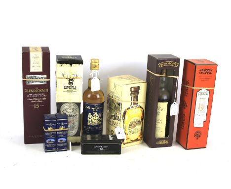Five bottles of whisky. Comprising one Glendronach aged 15 years, boxed, 1 litre (part full), 40% vol, one Bowmore Scotch Dis