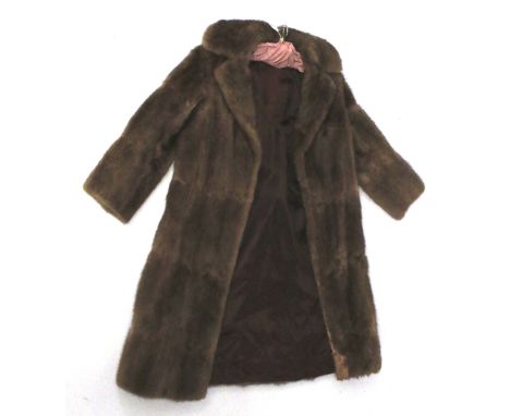 A ladies vintage brown fur coat. With purple silk lining, L108cm