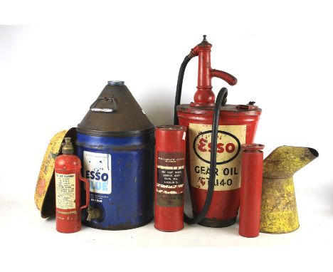 An assortment of vintage Petrol cans and fire extinguishers. Including 'Esso Oil' and 'Esso Blue' examples, etc.