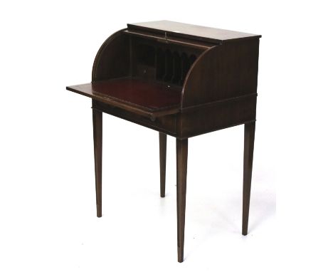 A 20th century veneered cylinder roll-top desk. The extending shelf with a red insert and fitted compartments, raised on tape