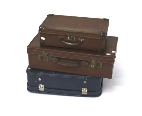 Three vintage suitcases. Comprising two brown leather examples with handles to the top, L61cm, and one in blue, L55cm