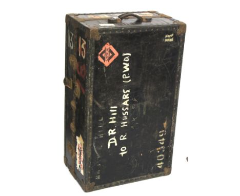 An early 20th century travelling trunk. With leather bound edging and handles to either side,  with a blue floral interior an