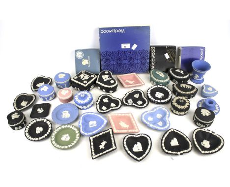 A collection of Wedgwood jasperware. Including lidded pots, trays, a candlestick, etc, some in the original boxes, in a varie