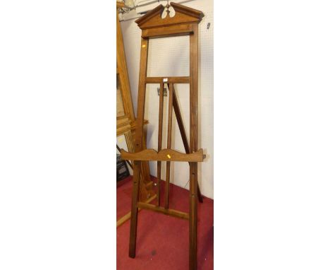 A walnut freestanding artist's easel, with adjustable ledgeOverall in very good condition with a few minor scratches to the m