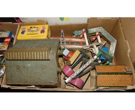 A quantity of Hornby 0 gauge lineside accessories together with a Pelham Puppet box, and a Japanese tinplate dining car