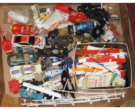 A tray containing an interesting selection of Scalextric and slot-racing cars, some examples sealed in original packaging 