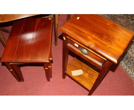 A contemporary Eastern hardwood two-tier single drawer lamp table, width 45cm, together with a hardwood nest of three occasio