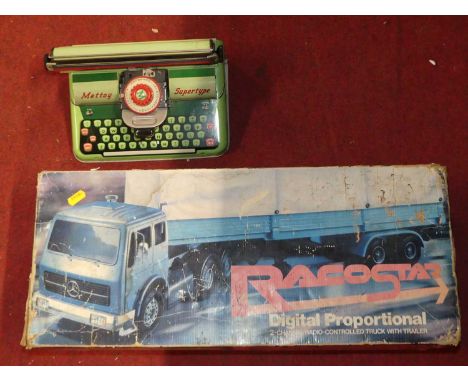 A Raco Star digital proportion radio controlled Mercedes truck and trailer together with a tinplate Mettoy typewriter