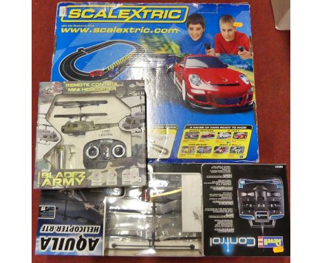 A Scalextric Speed Stars gift set; together with a pair pf radio controlled helicopters by Revell and Bladez Toys 