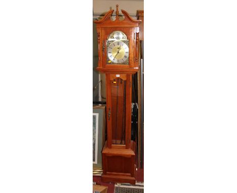 A contemporary cherrywood Tempus Fugit grandmother clock, having a silvered and brass dial titled Emperor, with glazed trunk 