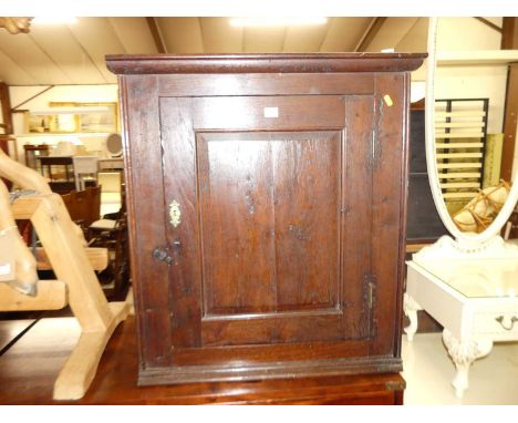 A 19th century provincial oak single door hanging corner cupboardVertical split to door.Hinges are replacement.Colour is good