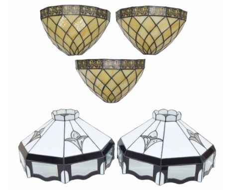 Two decorative octagonal stained and milk glass ceiling light shades, 19" diameter; together with a set of three demi lune gl