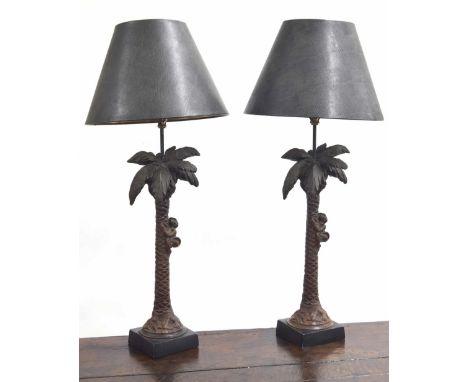 Pair of 'Austin Sculpture Home Collection' resin table lamps, modelled as monkeys climbing palm trees, with shades, 33" high 