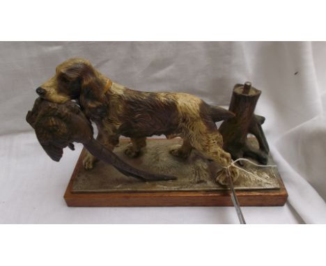 German metal figure of a Spaniel with Pheasant in mouth, tree trunk beside in the form of a striker lighter all on rectangula