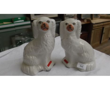 Pair of early 20th century white spaniel dog mantelpiece ornaments (each 9" high)