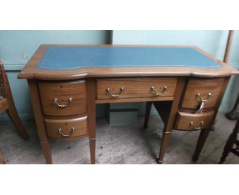 20th century kneehole writing desk, with gilt and light blue inset to the writing area, fitted central and 2 wing cupboards t