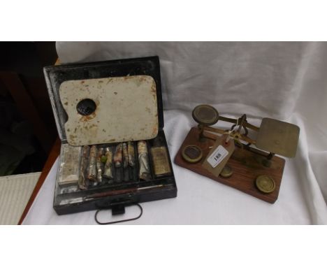 Pair of brass letter scales with 3 weights and a 10 case of Artists paints together with palette 