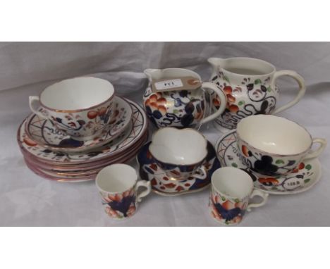 Selection of cobalt blue and rust ground and gilt early 20th century lustre ware incl. 2 jugs, cups and saucers etc. (13 piec