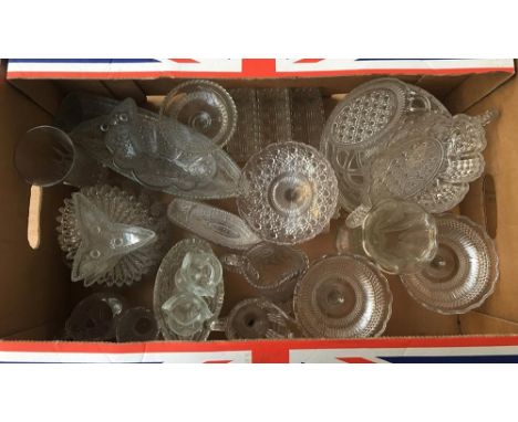A large mixed lot of moulded glassware, including bowls, trinket dishes, jugs, several bowls in the form of boats, etc 