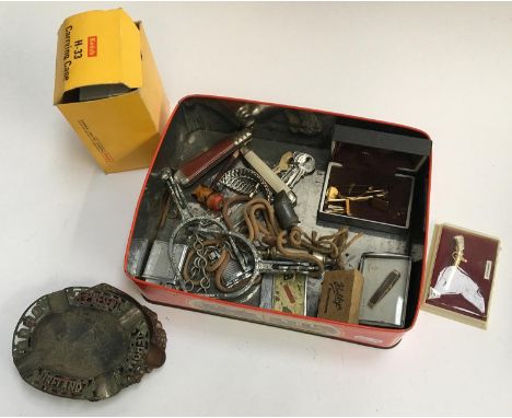 A mixed lot to include several lighters, several vintage whistles, penknives, various tie pins and cufflinks, etc 