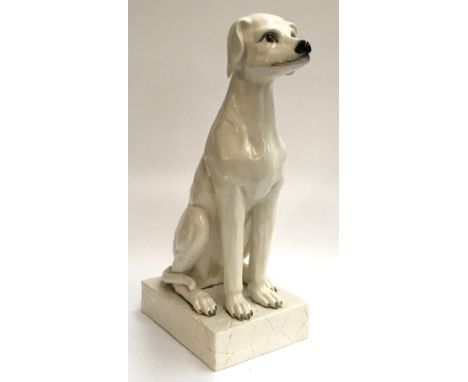 A large Continental ceramic seated dog (repaired), 63cmH 