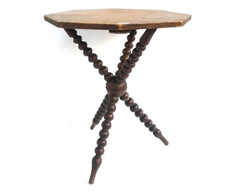 An octagonal occasional table, on three converging bobbin turned supports, 66cmH 