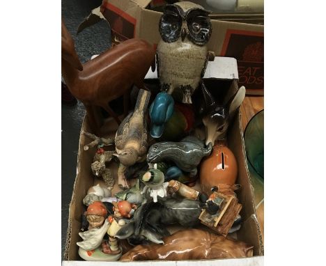 A mixed lot of ceramic and other figurines, to include owls, seals, elephants, poodle, donkey, birds, etc 
