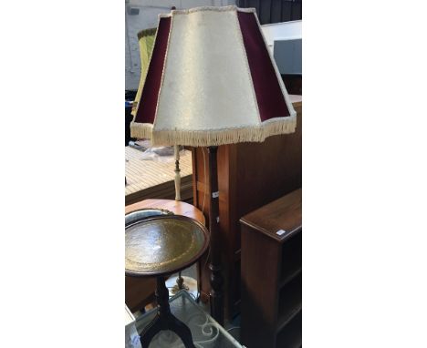 A turned oak standard lamp with shade 