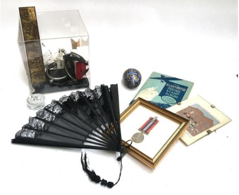 A mixed lot of interesting thing to include: several watercolour sets, stirrups, ceramic trinket boxes, a black lace fan, Isl