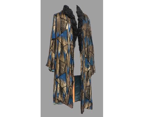 Circa 1920-30s Stylish Evening Coat in a teal blue, black and gold geometric design with black velvet smocked trim to the col
