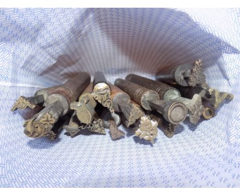*Decorative finishing tools. A collection of twenty brass decorative finishing tools, comprising mostly centre and corner too