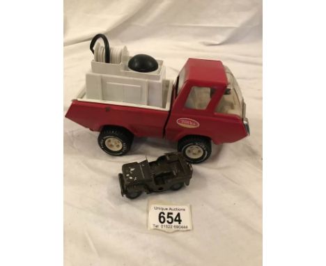 A Tonka pressed steel fire engine and Triang minic jeep.