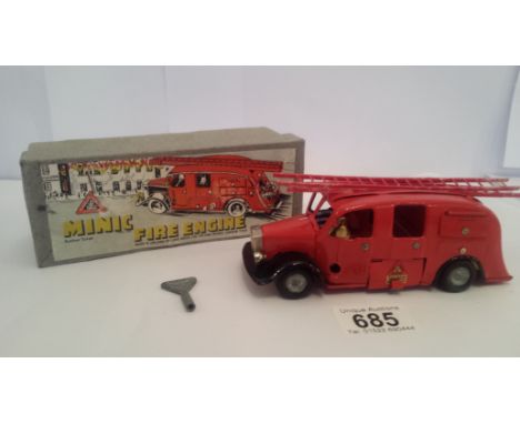 A boxed Triang minic fire engine.