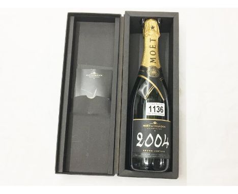 A cased bottle of Moet &amp; Chandon 2004 Grand Vintage champagne.