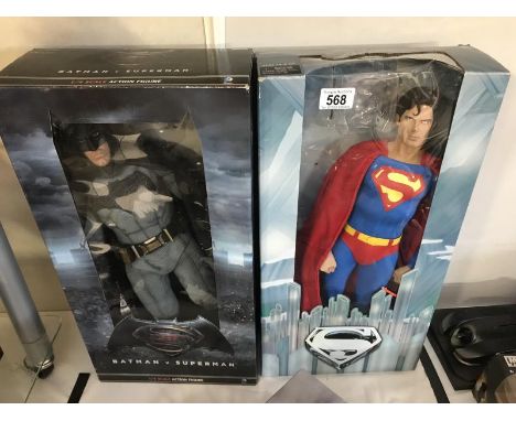 A boxed 1/4 scale action model of Batman from Batman V Superman &amp; a large boxed figurine of Superman from Superman The Mo