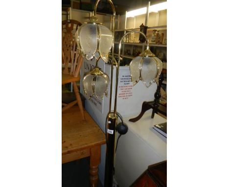 A triple light standard lamp.