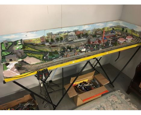 An 'N Gauge' railway layout including a box of Hornby Minitrix and Lima rolling stock and engines.
