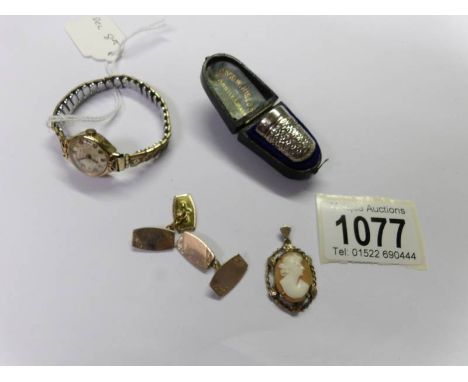 A cameo pendant, a pair of cuff links, A ladies gold Rotary wrist watch on yellow metal strap and a silver thimble marked 'CH