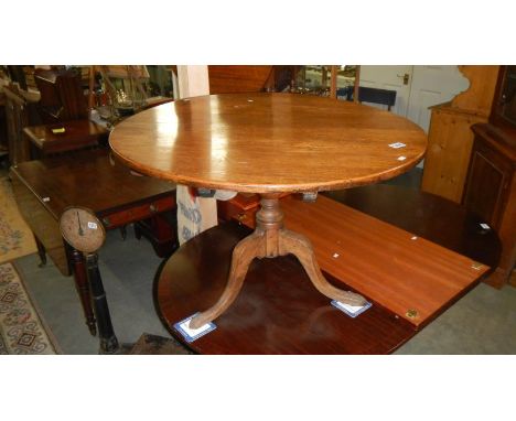 An oak tripod table.