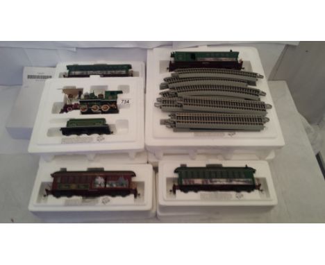 A Hawthorne village train set of Thomas Kinkades Christmas express consisting of steam engine, observation car, studio car, c