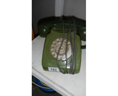 A vintage dial telephone.