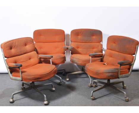 Charles and Ray Eames for Herman Miller, four armchairs, model ES104, 1970s, aluminium frames, orange cotton pads, four-wheel