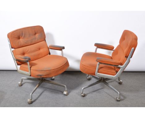 Charles and Ray Eames for Herman Miller, two armchairs, model ES104, 1970s, aluminium frames, orange cotton pads, four-wheel 