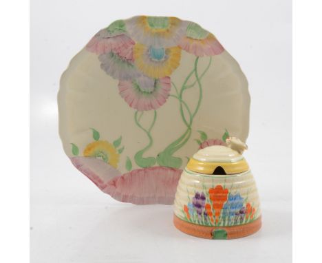 Clarice Cliff, a Crocus beehive preserve pot and cover, Newport Pottery backstamp, 10cm; and an Aurea pattern plate, scallope