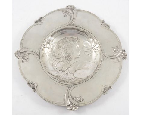 An Italian Art Nouveau pewter charger, by Achille Gamba, circa 1900, the central well cast in shallow relief with maiden in p